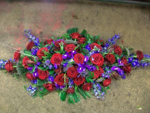 Red and blue spray floral arrangement