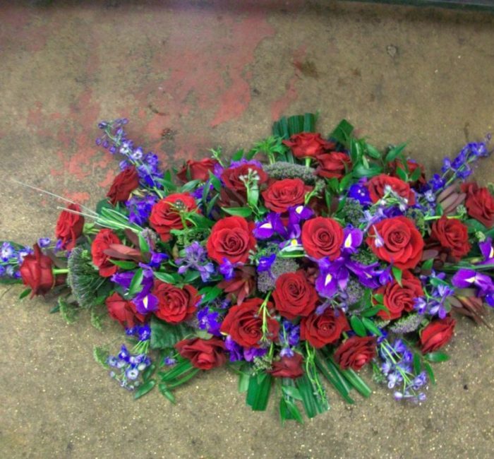 Red and blue spray floral arrangement